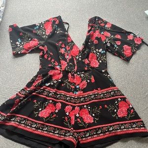 Floral open back play suit trixxi black and red flowers roses with open back